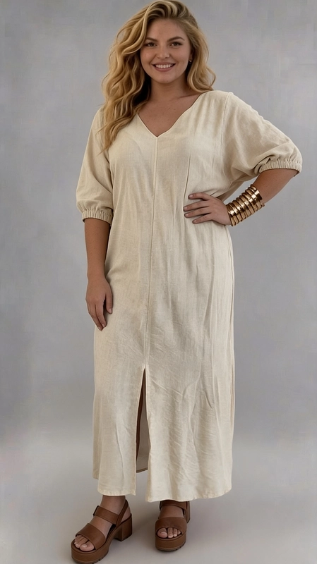 Φόρεμα εκρού καλοκαιρινό - FRW640 | Candiashop Boutique, Ένα υπέροχο maxi φόρεμα σε αμμώδες μπεζ χρώμα, ιδανικό για τη γυναίκα που αναζητά άνεση χωρίς να θυσιάζει το στυλ. Κατασκευασμένο από ύφασμα λινού τύπου με φυσική υφή, προσφέρει απαλή αίσθηση στο δέρμα και εξαιρετική αναπνευσιμότητα, καθιστώντας το ιδανικό για τις ζεστές μέρες. Το φόρεμα διαθέτει κομψή V-λαιμόκοψη που κολακεύει τις καμπύλες, ενώ η χαλαρή γραμμή του εξασφαλίζει άνετη εφαρμογή για plus size σιλουέτες. Τα φουσκωτά μανίκια με ελαστικό τελείωμα στον καρπό προσθέτουν ένα ρομαντικό και σύγχρονο άγγιγμα, ενώ η κεντρική ραφή μπροστά και το ελαφρύ άνοιγμα στο κάτω μέρος δίνουν κίνηση και χάρη στο σύνολο. Μπορεί να φορεθεί με καφέ πλατφόρμες ή σανδάλια για καλοκαιρινές εξόδους, ενώ συνδυάζεται εξίσου ωραία με sneakers για μια πιο casual εμφάνιση. Κατάλληλο για βόλτες, καλοκαιρινά γεύματα, αλλά και για beach look με την κατάλληλη αξεσουάρ.
