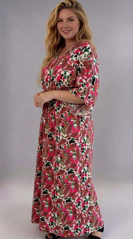 Φόρεμα φούξια καλοκαιρινό - FRW676 | Candiashop Boutique, Ένα εντυπωσιακό maxi φόρεμα plus size που συνδυάζει άνεση και στυλ με έναν μοναδικό τρόπο. Το φόρεμα διαθέτει ένα ζωντανό τροπικό μοτίβο με φύλλα και αφηρημένα σχήματα σε αποχρώσεις φούξια, βαθύ κόκκινο, πράσινο, καφέ και μαύρο, πάνω σε λευκό φόντο, δημιουργώντας μια εντυπωσιακή και χαρούμενη εμφάνιση. Το σχέδιό του χαρακτηρίζεται από φαρδιές, ρέουσες γραμμές με κοντά μανίκια τύπου kimono και λαιμόκοψη V, που προσφέρουν άνεση και ελευθερία κινήσεων. Η ελαστική μέση κολακεύει τη σιλουέτα, τονίζοντας την φόρμα χωρίς να περιορίζει, ενώ το μήκος maxi προσφέρει κομψότητα και κάλυψη. Ιδανικό για καλοκαιρινές βόλτες, παραλία, καφέ με φίλες ή καλοκαιρινές εκδρομές. Μπορεί να φορεθεί με σανδάλια ή εσπαντρίγιες για ένα boho look, ή με λευκά sneakers για πιο casual εμφάνιση. Ένα must-have κομμάτι για κάθε γυναίκα που αγαπά τα έντονα χρώματα και την άνετη, θηλυκή μόδα.