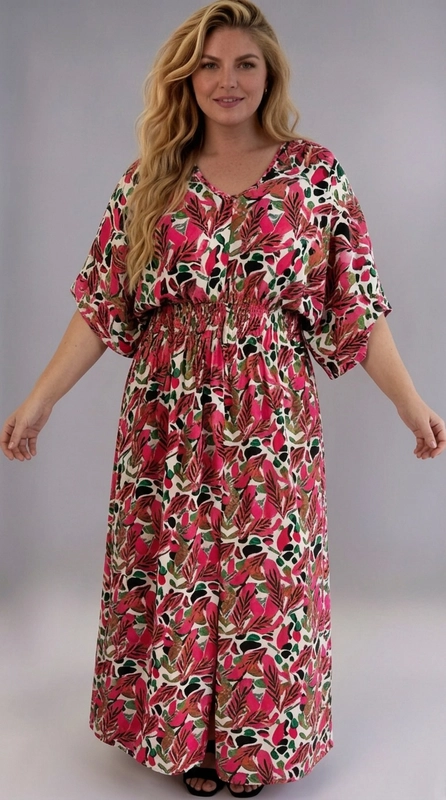 Φόρεμα φούξια καλοκαιρινό - FRW676 | Candiashop Boutique, Ένα εντυπωσιακό maxi φόρεμα plus size που συνδυάζει άνεση και στυλ με έναν μοναδικό τρόπο. Το φόρεμα διαθέτει ένα ζωντανό τροπικό μοτίβο με φύλλα και αφηρημένα σχήματα σε αποχρώσεις φούξια, βαθύ κόκκινο, πράσινο, καφέ και μαύρο, πάνω σε λευκό φόντο, δημιουργώντας μια εντυπωσιακή και χαρούμενη εμφάνιση. Το σχέδιό του χαρακτηρίζεται από φαρδιές, ρέουσες γραμμές με κοντά μανίκια τύπου kimono και λαιμόκοψη V, που προσφέρουν άνεση και ελευθερία κινήσεων. Η ελαστική μέση κολακεύει τη σιλουέτα, τονίζοντας την φόρμα χωρίς να περιορίζει, ενώ το μήκος maxi προσφέρει κομψότητα και κάλυψη. Ιδανικό για καλοκαιρινές βόλτες, παραλία, καφέ με φίλες ή καλοκαιρινές εκδρομές. Μπορεί να φορεθεί με σανδάλια ή εσπαντρίγιες για ένα boho look, ή με λευκά sneakers για πιο casual εμφάνιση. Ένα must-have κομμάτι για κάθε γυναίκα που αγαπά τα έντονα χρώματα και την άνετη, θηλυκή μόδα.