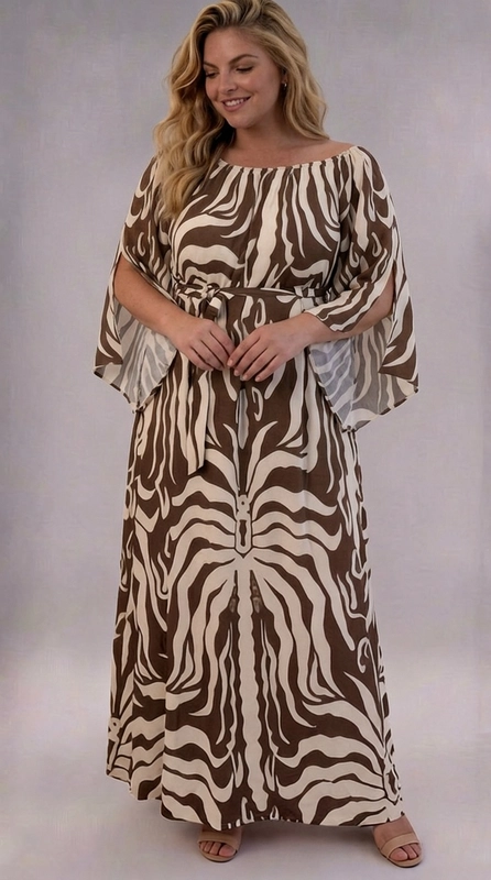 Φόρεμα καφέ καλοκαιρινό - FRW716 | Candiashop Boutique, Ένα εντυπωσιακό maxi φόρεμα που συνδυάζει το animal print με την κομψότητα και την άνεση, ιδανικό για γυναίκες plus size που αγαπούν τη μόδα. Το φόρεμα διαθέτει ένα τολμηρό μοτίβο τύπου ζέβρας σε χρώματα καφέ σοκολάτας και κρεμ εκρού, που δημιουργεί μια αρμονική και εξωτική αισθητική. Η ρέουσα, ελαφριά ύφανση του υφάσματος χαρίζει μια αέρινη και θηλυκή σιλουέτα, ενώ τα φαρδιά μανίκια τύπου kimono προσθέτουν δραματική χάρη στο σύνολο. Η λαιμόκοψη και η ζώνη στη μέση ορίζουν κομψά τη γραμμή του σώματος, προσφέροντας μια κολακευτική εφαρμογή. Το φόρεμα αυτό είναι ιδανικό για καλοκαιρινές εξόδους, beach parties, καλοκαιρινά γαμήλια πάρτι ή βραδινές εκδηλώσεις. Μπορεί να συνδυαστεί με σανδάλια σε μπεζ ή χρυσό χρώμα και χρυσά αξεσουάρ για ένα ολοκληρωμένο, boho-chic αποτέλεσμα. Μια επιλογή που αναδεικνύει την προσωπικότητα και την αυτοπεποίθηση κάθε γυναίκας.
