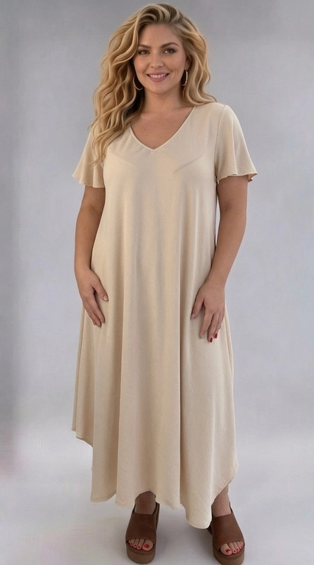 Φόρεμα κρεμ καλοκαιρινό - FRW799 | Candiashop Boutique, Ένα υπέροχο φόρεμα σε αμμώδες μπεζ χρώμα που ενσαρκώνει την αίσθηση της άνεσης και της κομψότητας. Με κοφτή V-λαιμόκοψη και φαρδιά, βολάν μανίκια που πέφτουν χαριτωμένα στους ώμους, το φόρεμα αυτό αποπνέει μια αέρινη, γυναικεία διάθεση. Η Α γραμμή του με ρέουσα σιλουέτα κολακεύει κάθε σώμα, ενώ το ασύμμετρο τελείωμα στο τελείωμα του φορέματος προσθέτει μια μοντέρνα πινελιά στο σύνολο. Ιδανικό για plus size γυναίκες που αναζητούν στυλ χωρίς συμβιβασμούς στην άνεση. Το μονόχρωμο σχέδιο σε ουδέτερο τόνο το καθιστά εύκολα συνδυάσιμο με διάφορα αξεσουάρ. Μπορεί να φορεθεί με πλατφόρμες ή σανδάλια για καλοκαιρινές εξόδους, αλλά και με ένα κομψό σακάκι για πιο επίσημες περιστάσεις. Κατάλληλο για καλοκαιρινές εκδρομές, γεύματα σε εξωτερικούς χώρους ή ακόμα και για χαλαρές καθημερινές εμφανίσεις. Ένα must-have κομμάτι για κάθε γυναικεία γκαρνταρόμπα!