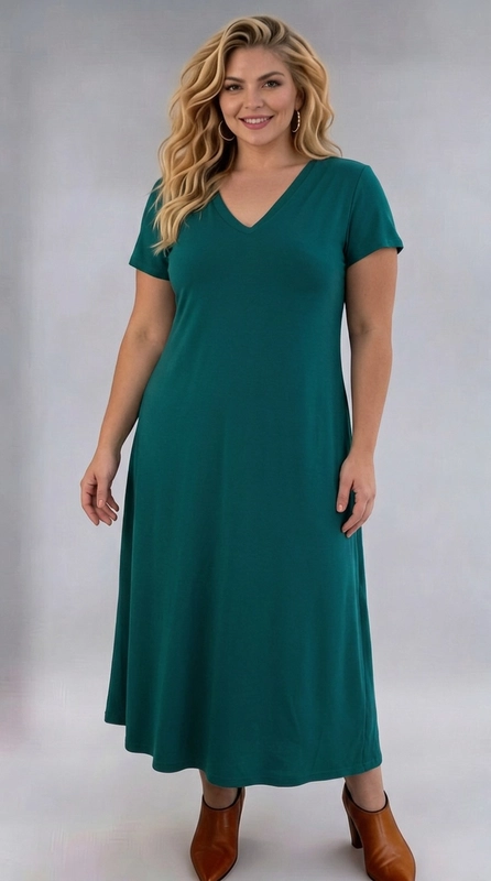 Φόρεμα πετρόλ καλοκαιρινό - FRW803 | Candiashop Boutique, Ένα υπέροχο maxi φόρεμα σε βαθύ πετρόλ χρώμα που αναδεικνύει κάθε plus size σιλουέτα με κομψό και θηλυκό τρόπο. Το μονόχρωμο σχέδιό του με λεία υφή δίνει μια αίσθηση πολυτέλειας και εκλέπτυνσης, ενώ η Α γραμμή που ακολουθεί δημιουργεί μια ρέουσα και άνετη εφαρμογή που κολακεύει το σώμα. Ο κομψός λαιμός σε σχήμα V επιμηκύνει οπτικά τον λαιμό, ενώ τα κοντά μανίκια προσθέτουν μια αίσθηση κομψότητας και άνεσης. Ιδανικό για γυναίκες που αναζητούν στυλ και άνεση, αυτό το φόρεμα μπορεί να φορεθεί σε επαγγελματικά ραντεβού, σε οικογενειακές εξόδους ή σε ημι-επίσημες περιστάσεις. Συνδυάζεται τέλεια με ankle boots για ένα chic αποτέλεσμα, όπως φαίνεται και στη φωτογραφία, ή με ψηλοτάκουνα πέδιλα για βραδινές εμφανίσεις. Το μήκος του, που φτάνει κάτω από τη γάμπα, το καθιστά κατάλληλο για κάθε εποχή, ενώ το ελαστικό ύφασμά του εξασφαλίζει άψογη εφαρμογή και ελευθερία κινήσεων.