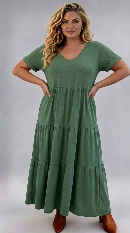 Φόρεμα πράσινο καλοκαιρινό - FRW657 | Candiashop Boutique, Ανακαλύψτε την απόλυτη άνεση και το αδιαμφισβήτητο στυλ με αυτό το υπέροχο maxi φόρεμα σε βαθύ πράσινο χρώμα σαλβία, ιδανικό για plus size σιλουέτες. Το φόρεμα διαθέτει κομψό V-λαιμόκοψη που κολακεύει το ντεκολτέ, κοντά μανίκια με διακοσμητική αναδίπλωση στο τελείωμα και ένα εντυπωσιακό tiered σχέδιο με τρία διαδοχικά επίπεδα που δημιουργούν μια ρομαντική, ρέουσα σιλουέτα. Το ύφασμα, μαλακό και ελαφρύ, εξασφαλίζει άνεση καθ' όλη τη διάρκεια της ημέρας, ενώ η χαλαρή εφαρμογή του επιτρέπει ελεύθερη κίνηση. Κατάλληλο για καλοκαιρινές εξόδους, ρομαντικά ραντεβού, αλλά και για πιο χαλαρές, καθημερινές στιγμές. Μπορεί να συνδυαστεί με κάμελ μποτάκια ή σανδάλια για ένα boho-chic αποτέλεσμα, ενώ η προσθήκη ενός δερμάτινου ζωναριού μπορεί να τονίσει τη μέση για μια πιο δομημένη εμφάνιση. Ένα must-have κομμάτι για κάθε γυναίκα που αγαπά την άνεση χωρίς να θυσιάζει την κομψότητα.