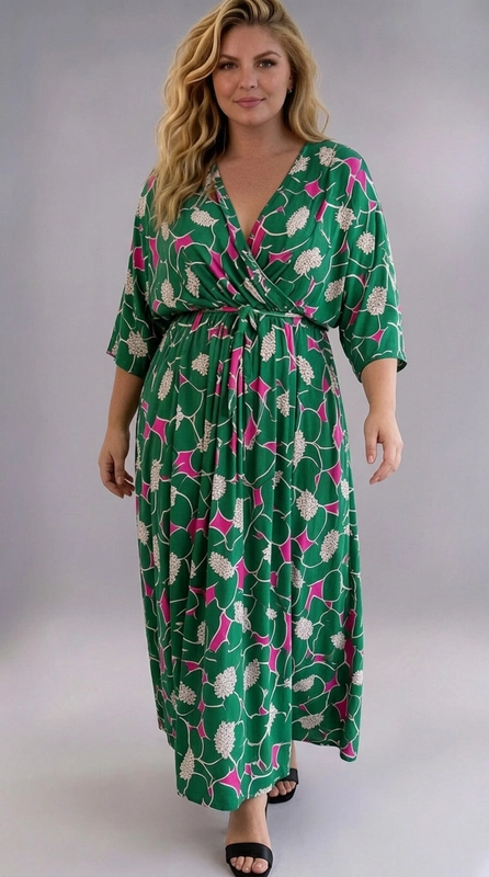 Φόρεμα πράσινο καλοκαιρινό - FRW699 | Candiashop Boutique, Ένα εντυπωσιακό maxi φόρεμα που συνδυάζει στυλ και άνεση, ιδανικό για γυναίκες με καμπύλες. Το φόρεμα διαθέτει ένα ζωντανό floral μοτίβο σε βαθύ πράσινο φόντο, με ανθισμένα σχέδια σε κρεμ και έντονες φούξια λεπτομέρειες που του προσδίδουν μια καλοκαιρινή, χαρούμενη αίσθηση. Το κρουαζέ ντεκολτέ σε σχήμα V δημιουργεί μια κομψή και κολακευτική γραμμή, ενώ η ζώνη στη μέση τονίζει το σώμα και δίνει ορισμένη σιλουέτα. Τα μανίκια τρία τέταρτα προσθέτουν κομψότητα και καλύπτουν διακριτικά, ενώ η ρέουσα φούστα που φτάνει μέχρι τον αστράγαλο εξασφαλίζει άνετη κίνηση. Μπορεί να φορεθεί με σανδάλια για μια καλοκαιρινή βόλτα, με πέδιλα για επίσημες εκδηλώσεις ή με ψηλοτάκουνα για βραδινές εξόδους. Ιδανικό για καλοκαιρινές εκδρομές, γάμους, βαφτίσια ή ρομαντικά δείπνα, αυτό το φόρεμα αποτελεί μια must-have επιλογή για κάθε γυναίκα που θέλει να αισθάνεται όμορφη και σέξι.
