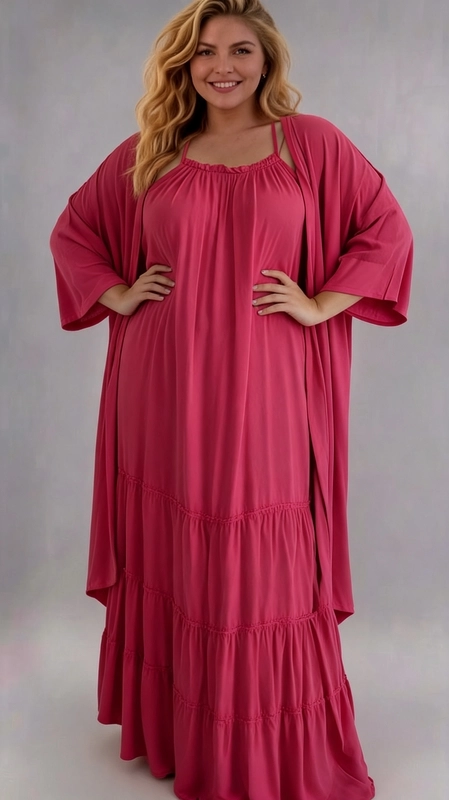 Φόρεμα ροζ καλοκαιρινό - FRW651 | Candiashop Boutique, Ένα υπέροχο σύνολο σε έντονο φουξ χρώμα που αποπνέει θηλυκότητα και χάρη. Αποτελείται από ένα maxi φόρεμα με λεπτές τιράντες και συγκεντρωμένο ελαστικό ντεκολτέ που δημιουργεί ένα ρομαντικό αποτέλεσμα, σε συνδυασμό με ένα φαρδύ kimono-style παλτό με μακριά, ρέουσα σιλουέτα και φαρδιά μανίκια. Το φόρεμα διαθέτει βολάν στο κάτω μέρος που προσδίδει κίνηση και ζωντάνια, ενώ το σύνολο έχει σχεδιαστεί ειδικά για plus size σώματα, προσφέροντας άνεση και κομψότητα. Το μαλακό, ελαστικό ύφασμα εφαρμόζει άψογα στις καμπύλες, δημιουργώντας μια ρευστή γραμμή που κολακεύει κάθε σιλουέτα. Ιδανικό για καλοκαιρινές βόλτες, βραδινές εξόδους, καλοκαιρινές εκδηλώσεις ή ακόμα και για παραλία. Μπορεί να φορεθεί με σανδάλια ή πλατφόρμες για ένα πιο boho-chic αποτέλεσμα, ή με ψηλοτάκουνα για μια πιο επίσημη εμφάνιση. Ένα must-have κομμάτι για κάθε γυναίκα που θέλει να συνδυάσει στυλ και άνεση.