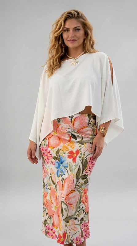 Φούστα ροζ καλοκαιρινή plus size - FPS154 | Candiashop Boutique, Η φούστα αυτή είναι η ιδανική επιλογή για κάθε γυναίκα που αγαπά τη θηλυκότητα και την άνεση. Με βάση κρεμ απόχρωση, διακοσμείται με ένα πλούσιο floral μοτίβο που περιλαμβάνει ανθισμένα λουλούδια σε αποχρώσεις κοραλί, ροζ και μπλε, ενώ τα φύλλα σε χακί και πράσινο χρώμα προσδίδουν μια φυσική, ζωντανή αίσθηση. Η γραμμή της φούστας είναι maxi, με κομψή εφαρμογή που αγκαλιάζει αρμονικά τις καμπύλες, ιδανική για plus size σιλουέτες. Το ύφασμα φαίνεται ελαφρύ και ρέον, κατάλληλο για τις ζεστές εποχές της άνοιξης και του καλοκαιριού. Μπορεί να φορεθεί με ένα λευκό ή κρεμ πόντσο, όπως φαίνεται στη φωτογραφία, αλλά και με ένα απλό μονόχρωμο τοπ ή πουκάμισο. Συνδυάζεται υπέροχα με μποτάκια καφέ ή σανδάλια, ενώ χρυσά αξεσουάρ αναδεικνύουν το σύνολο. Ιδανική για βόλτες, γεύματα σε εξωτερικούς χώρους ή καλοκαιρινές εκδηλώσεις.