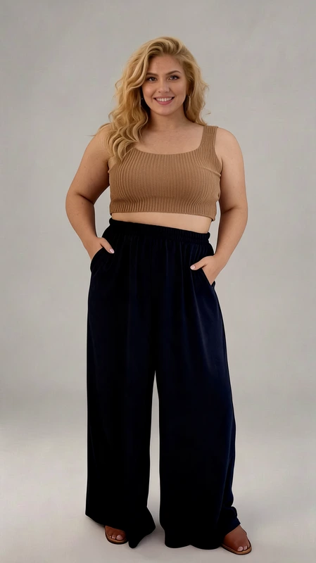 Παντελόνα γυναικεία plus size καλοκαιρινό σκούρη μπλε - PANT176 | Candiashop Boutique, Αυτό το μοντέρνο σετ αποτελείται από ένα κομψό μπουστάκι σε απόχρωση καμηλό και μια φαρδιά παντελόνα σε βαθύ ναυτικό μπλε. Το ριμπ πλεκτό μπουστάκι με τετράγωνη λαιμόκοψη και φαρδιές τιράντες προσφέρει άνετη εφαρμογή, ενώ αναδεικνύει διακριτικά τη σιλουέτα. Η παντελόνα με την ελαστική μέση διαθέτει πρακτικές τσέπες και ρέει αβίαστα, χαρίζοντας άνεση και στυλ σε κάθε κίνηση. Ο συνδυασμός των δύο κομματιών δημιουργεί μια εντυπωσιακή αντίθεση που κολακεύει κάθε σωματότυπο. Ιδανικό για καλοκαιρινές βραδινές εξόδους, μπορεί εύκολα να μεταμορφωθεί από casual σε πιο επίσημο look με τα κατάλληλα αξεσουάρ. Συνδυάστε το με πλατφόρμες ή σανδάλια για μια εμφάνιση γεμάτη αυτοπεποίθηση. Η ποιοτική κατασκευή εξασφαλίζει άνετη εφαρμογή για πολλές ώρες, ενώ το υλικό προσφέρει εξαιρετική αίσθηση στο δέρμα. Ένα ευέλικτο σύνολο που θα γίνει αγαπημένο κομμάτι της καλοκαιρινής σας γκαρνταρόμπας.