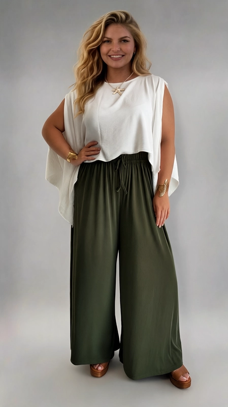 Παντελόνα γυναικεία χακί καλοκαιρινή plus size - PANT191 | Candiashop Boutique, Η παντελόνα αυτή σε βαθύ χακί χρώμα είναι η ιδανική επιλογή για κάθε plus size γυναίκα που αναζητά στυλ και άνεση σε ένα. Με την ευρύχωρη, palazzo γραμμή της, χαρίζει μια ρευστή και κομψή σιλουέτα που κολακεύει κάθε σώμα. Η ελαστική μέση με διακοσμητικό κορδόνι εξασφαλίζει τέλεια εφαρμογή και άνεση καθ' όλη τη διάρκεια της ημέρας, ενώ το απαλό, ελαφρύ ύφασμα πέφτει με χάρη και κινείται άνετα με κάθε βήμα. Το μονόχρωμο σχέδιό της σε ώριμο, γήινο τόνο χακί την καθιστά εξαιρετικά ευέλικτη και εύκολη στον συνδυασμό. Μπορεί να φορεθεί με λευκή, κρεμ ή μπεζ μπλούζα για ένα αέρινο καλοκαιρινό look, αλλά και με ένα fitted top ή ένα εφαρμοστό πουλόβερ για πιο σύνθετα σύνολα. Ιδανική για καθημερινές εξόδους, βόλτες, επαγγελματικά ραντεβού ή χαλαρά βραδινά, αυτή η παντελόνα αποτελεί must-have κομμάτι για κάθε γυναικεία γκαρνταρόμπα.
