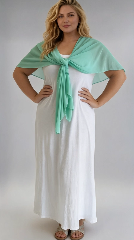 Μπολερό γαλάζιο καλοκαιρινό plus size - BOL114 | Candiashop Boutique, Ανακαλύψτε το ιδανικό καλοκαιρινό αξεσουάρ που θα μεταμορφώσει κάθε σας εμφάνιση. Αυτό το γυναικείο μπολερό είναι φτιαγμένο από ελαφρύ, διαφανές ύφασμα σιφόν που χαρίζει μια αέρινη, ρομαντική αίσθηση. Ο μονόχρωμος σχεδιασμός του σε έντονο βεραμάν χρώμα το καθιστά ευέλικτο και εύκολο να συνδυαστεί με διάφορα ρούχα. Το μπολερό φοριέται απλά τυλιγμένο γύρω από τους ώμους και δένεται μπροστά με έναν χαλαρό κόμπο, δημιουργώντας ένα κομψό και θηλυκό αποτέλεσμα. Η ελεύθερη εφαρμογή του το κάνει ιδανικό για plus size γυναίκες, καθώς κολακεύει τη σιλουέτα χωρίς να περιορίζει τις κινήσεις. Μπορεί να φορεθεί πάνω από λευκά ή μονόχρωμα φορέματα, όπως φαίνεται στη φωτογραφία, αλλά και πάνω από παντελόνια ή φούστες για μια ολοκληρωμένη καλοκαιρινή εμφάνιση. Ιδανικό για βραδινές εξόδους, γαμήλιες δεξιώσεις, καλοκαιρινές εκδηλώσεις ή ακόμα και για δροσιά σε κλιματιζόμενους χώρους.