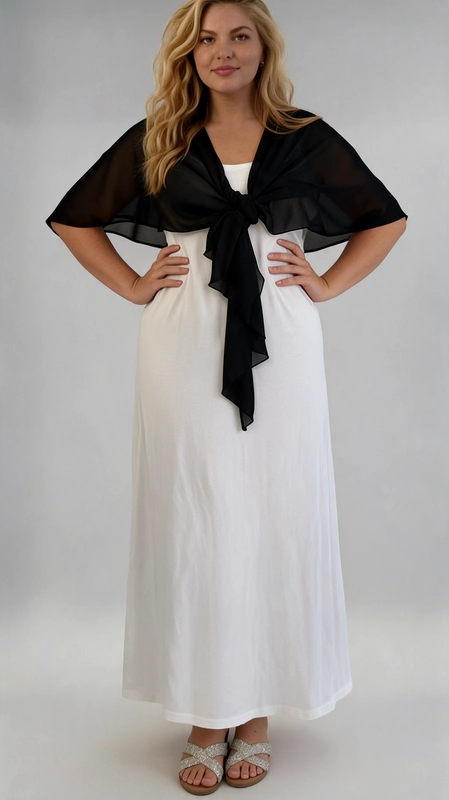 Μπολερό μαύρο καλοκαιρινό plus size - BOL122 | Candiashop Boutique, Ένα κομψό και θηλυκό καλοκαιρινό μπολερό σε βαθύ μαύρο χρώμα, ιδανικό για γυναίκες plus size που αναζητούν στυλ και άνεση. Κατασκευασμένο από ελαφριά, διαφανή σιφόν ύφανση, προσφέρει μια αέρινη και ρομαντική αίσθηση, τέλεια για τις ζεστές καλοκαιρινές μέρες. Το ιδιαίτερο χαρακτηριστικό του είναι το κορδόνι δέσιμο στο μπροστινό μέρος, που δημιουργεί ένα κομψό φιόγκο. Τα φαρδιά μανίκια τύπου cape πέφτουν χαλαρά στους ώμους, δίνοντας μια ρευστή και θηλυκή σιλουέτα που κολακεύει κάθε σώμα. Μπορεί να φορεθεί πάνω από φορέματα, όπως το λευκό maxi φόρεμα της εικόνας, αλλά και με παντελόνια ή φούστες για έξοδο, βόλτα ή καλοκαιρινές εκδηλώσεις. Συνδυάζει την απλότητα με την κομψότητα, καθιστώντας το ένα must-have κομμάτι για κάθε καλοκαιρινή γκαρνταρόμπα.