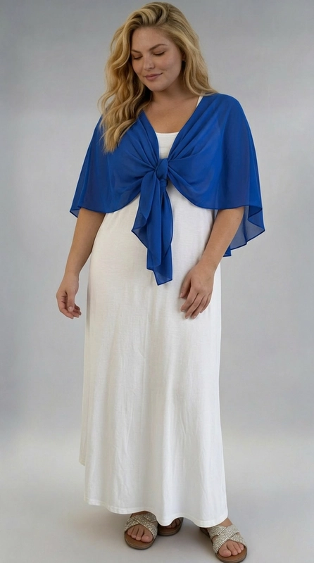 Μπολερό μπλε ρουά καλοκαιρινό plus size - BOL116 | Candiashop Boutique, Ανακαλύψτε την τέλεια καλοκαιρινή επιλογή για κάθε σιλουέτα με αυτό το υπέροχο μπολερό σε blue navy χρώμα. Κατασκευασμένο από ελαφρύ, διαφανές ύφασμα, προσφέρει μια αέρινη και ρομαντική αίσθηση, ιδανική για τις ζεστές καλοκαιρινές μέρες. Το μοναδικό του σχέδιο επιτρέπει να φορεθεί δεμένο μπροστά με έναν κομψό κόμπο, δημιουργώντας μια κολακευτική εφαρμογή που αναδεικνύει τη γυναικεία φιγούρα. Το αέρινο ύφασμα πέφτει χαριτωμένα στους ώμους και στην πλάτη, σχηματίζοντας μια κομψή κάπα που καλύπτει διακριτικά τα μπράτσα. Μπορεί να συνδυαστεί τέλεια με λευκό maxi φόρεμα για μια ολοκληρωμένη καλοκαιρινή εμφάνιση, όπως φαίνεται και στη φωτογραφία. Κατάλληλο για βραδινές εξόδους, γάμους, βαπτίσεις, αλλά και για χαλαρές καλοκαιρινές βόλτες. Η ζωντανή βασιλική μπλε απόχρωση προσθέτει μια δυναμική και κομψή πινελιά σε κάθε σύνολο, ενώ η plus size γραμμή εξασφαλίζει άνεση και στυλ για όλες τις γυναίκες.