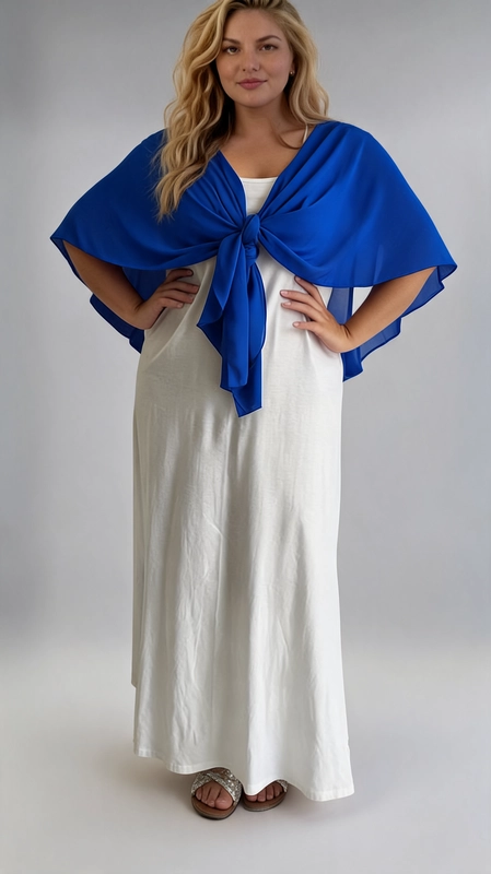 Μπολερό μπλε ρουά καλοκαιρινό plus size - BOL116 | Candiashop Boutique, Ανακαλύψτε την τέλεια καλοκαιρινή επιλογή για κάθε σιλουέτα με αυτό το υπέροχο μπολερό σε blue navy χρώμα. Κατασκευασμένο από ελαφρύ, διαφανές ύφασμα, προσφέρει μια αέρινη και ρομαντική αίσθηση, ιδανική για τις ζεστές καλοκαιρινές μέρες. Το μοναδικό του σχέδιο επιτρέπει να φορεθεί δεμένο μπροστά με έναν κομψό κόμπο, δημιουργώντας μια κολακευτική εφαρμογή που αναδεικνύει τη γυναικεία φιγούρα. Το αέρινο ύφασμα πέφτει χαριτωμένα στους ώμους και στην πλάτη, σχηματίζοντας μια κομψή κάπα που καλύπτει διακριτικά τα μπράτσα. Μπορεί να συνδυαστεί τέλεια με λευκό maxi φόρεμα για μια ολοκληρωμένη καλοκαιρινή εμφάνιση, όπως φαίνεται και στη φωτογραφία. Κατάλληλο για βραδινές εξόδους, γάμους, βαπτίσεις, αλλά και για χαλαρές καλοκαιρινές βόλτες. Η ζωντανή βασιλική μπλε απόχρωση προσθέτει μια δυναμική και κομψή πινελιά σε κάθε σύνολο, ενώ η plus size γραμμή εξασφαλίζει άνεση και στυλ για όλες τις γυναίκες.