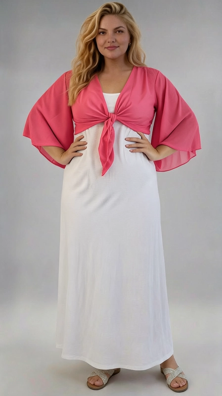 Μπολερό ροζ καλοκαιρινό plus size - BOL121 | Candiashop Boutique, Ανακαλύψτε το απόλυτο καλοκαιρινό αξεσουάρ με αυτό το εντυπωσιακό μπολερό σε ζωηρό φούξια χρώμα, που θα μεταμορφώσει κάθε σας εμφάνιση. Κατασκευασμένο από ελαφρύ, διάφανο ύφασμα σιφόν, προσφέρει μια αέρινη και θηλυκή αίσθηση, ιδανική για τις ζεστές καλοκαιρινές μέρες. Το κύριο χαρακτηριστικό του είναι τα φαρδιά, butterfly μανίκια που κυματίζουν χαριτωμένα με κάθε κίνηση, δημιουργώντας μια ρομαντική και κομψή σιλουέτα. Το μπροστινό δέσιμο με κόμπο προσθέτει έναν παιχνιδιάρικο χαρακτήρα, ενώ παράλληλα τονίζει τη μέση με κολακευτικό τρόπο, κάνοντάς το ιδιαίτερα κατάλληλο για plus size γυναίκες. Μπορεί να φορεθεί πάνω από λευκό ή μονόχρωμο φόρεμα, όπως φαίνεται στη φωτογραφία, αλλά και με ψηλόμεσο παντελόνι ή φούστα. Είναι η τέλεια επιλογή για βραδινές έξοδους, καλοκαιρινές εκδηλώσεις, γάμους ή ακόμα και για μια χαλαρή βόλτα. Το έντονο φούξια χρώμα του εγγυάται ότι θα τραβήξει όλα τα βλέμματα!