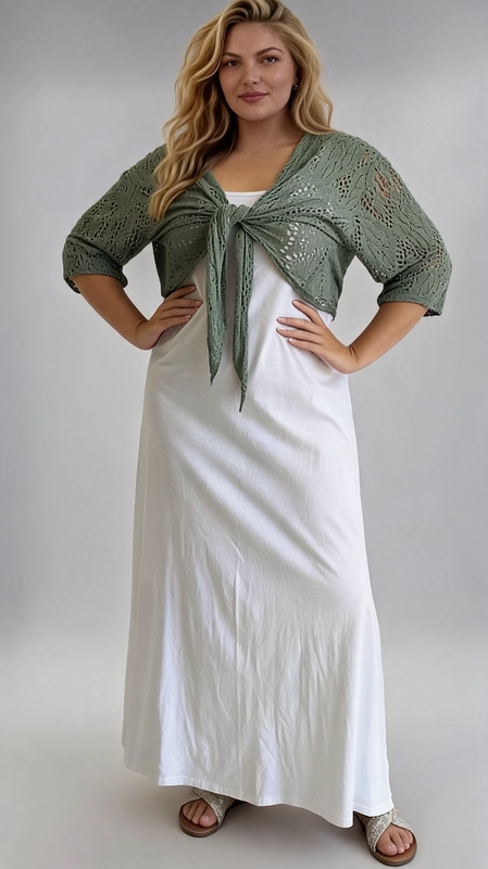 Μπολερό χακί καλοκαιρινό plus size - BOL110 | Candiashop Boutique, Ανακαλύψτε το απόλυτο καλοκαιρινό αξεσουάρ με αυτό το εντυπωσιακό γυναικείο μπολερό σε χακί πράσινο χρώμα, ιδανικό για plus size σιλουέτες. Κατασκευασμένο από διάτρητο πλεκτό ύφασμα μεό δαντελένιο μοτίβο, προσφέρει μια αέρινη και ελαφριά αίσθηση, τέλεια για τις ζεστές καλοκαιρινές μέρες. Το μπολερό διαθέτει μανίκια τριών τετάρτων και κλείνει μπροστά με έναν κομψό κόμπο που δημιουργεί μια γυναικεία, παιχνιδιάρικη γραμμή. Το cropped σχέδιο του αναδεικνύει τη γυναικεία σιλουέτα, ενώ το ανοιχτό πλέξιμο επιτρέπει στο δέρμα να αναπνέει. Μπορεί να φορεθεί πάνω από λευκά ή μονόχρωμα φορέματα, όπως φαίνεται στη φωτογραφία, αλλά και με παντελόνια ή φούστες για έναν casual-chic συνδυασμό. Ιδανικό για βόλτες στην παραλία, καλοκαιρινές εκδρομές ή χαλαρές βραδινές έξοδες. Ένα must-have κομμάτι που συνδυάζει στυλ και άνεση με απόλυτη χάρη.