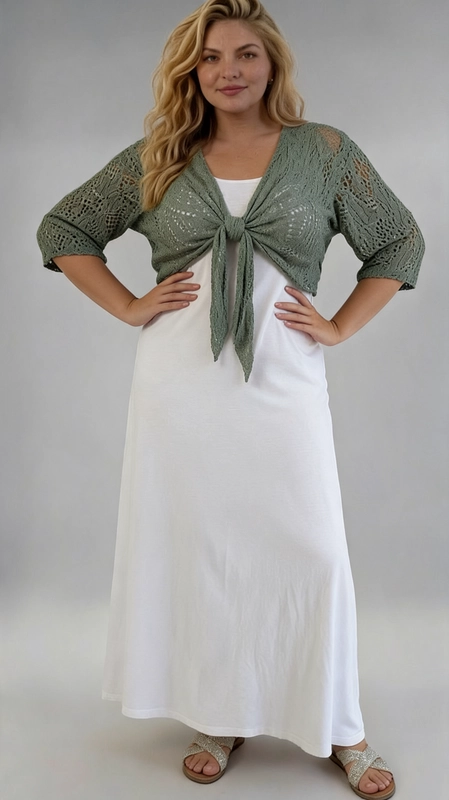 Μπολερό χακί καλοκαιρινό plus size - BOL110 | Candiashop Boutique, Ανακαλύψτε το απόλυτο καλοκαιρινό αξεσουάρ με αυτό το εντυπωσιακό γυναικείο μπολερό σε χακί πράσινο χρώμα, ιδανικό για plus size σιλουέτες. Κατασκευασμένο από διάτρητο πλεκτό ύφασμα μεό δαντελένιο μοτίβο, προσφέρει μια αέρινη και ελαφριά αίσθηση, τέλεια για τις ζεστές καλοκαιρινές μέρες. Το μπολερό διαθέτει μανίκια τριών τετάρτων και κλείνει μπροστά με έναν κομψό κόμπο που δημιουργεί μια γυναικεία, παιχνιδιάρικη γραμμή. Το cropped σχέδιο του αναδεικνύει τη γυναικεία σιλουέτα, ενώ το ανοιχτό πλέξιμο επιτρέπει στο δέρμα να αναπνέει. Μπορεί να φορεθεί πάνω από λευκά ή μονόχρωμα φορέματα, όπως φαίνεται στη φωτογραφία, αλλά και με παντελόνια ή φούστες για έναν casual-chic συνδυασμό. Ιδανικό για βόλτες στην παραλία, καλοκαιρινές εκδρομές ή χαλαρές βραδινές έξοδες. Ένα must-have κομμάτι που συνδυάζει στυλ και άνεση με απόλυτη χάρη.