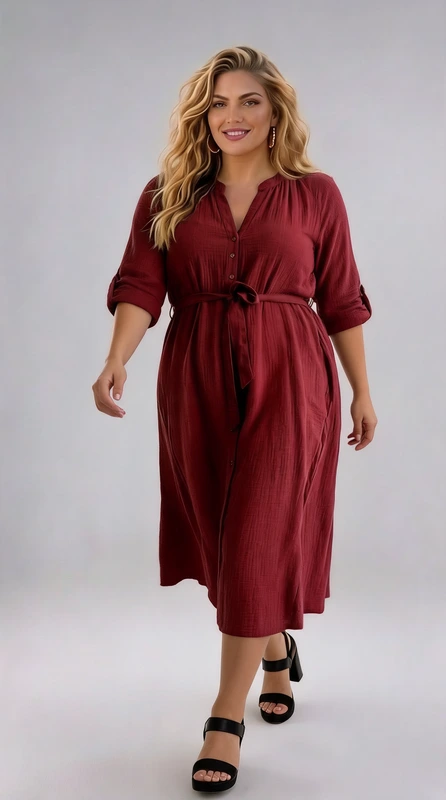 Plus size φόρεμα καφέ - FRW541 | Candiashop Boutique, Αυτό το κομψό φόρεμα σε πλούσιο μπορντό χρώμα αποτελεί την ιδανική επιλογή για την καθημερινή σας γκαρνταρόμπα. Κατασκευασμένο από απαλό, ρέον ύφασμα που χαρίζει άνεση και κολακευτική εφαρμογή σε κάθε σωματότυπο. Το φόρεμα διαθέτει λαιμόκοψη με άνοιγμα V και διακριτικές πιέτες που προσδίδουν θηλυκότητα, ενώ τα μανίκια 3/4 με αναδιπλούμενες μανσέτες προσφέρουν κομψή εμφάνιση και πρακτικότητα. Η μεσάτη γραμμή με τη ζώνη στη μέση τονίζει τη σιλουέτα, ενώ η φαρδιά φούστα που πέφτει απαλά μέχρι τους αστραγάλους χαρίζει κίνηση και θηλυκότητα. Ιδανικό για περιστάσεις από το γραφείο μέχρι βραδινές εξόδους, μπορεί να φορεθεί με ψηλοτάκουνα πέδιλα όπως στη φωτογραφία για βραδινές εμφανίσεις, ή με μποτάκια και ένα τζιν μπουφάν για πιο casual εμφανίσεις. Το βαθύ μπορντό χρώμα του είναι διαχρονικό και ταιριάζει άψογα με χρυσά ή ασημένια κοσμήματα για να ολοκληρώσετε το λουκ σας με στυλ.