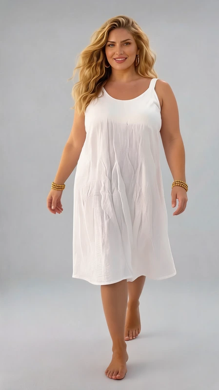 Plus size φόρεμα καλοκαιρινό λευκό - FRW419 | Candiashop Boutique, Απολαύστε την άνεση και την κομψότητα με αυτό το μοντέρνο λευκό φόρεμα που αγκαλιάζει όμορφα κάθε σιλουέτα. Κατασκευασμένο από ελαφρύ, αέρινο ύφασμα, είναι ιδανικό για τις ζεστές καλοκαιρινές ημέρες. Το αμάνικο σχέδιο με τη φαρδιά γραμμή και το στρογγυλό λαιμό προσφέρει άνεση και δροσιά, ενώ το μήκος στη μέση της γάμπας χαρίζει θηλυκότητα και ευελιξία στο ντύσιμο. Η απαλή λευκή απόχρωση είναι διαχρονική και εύκολα συνδυάζεται με αξεσουάρ σε κάθε χρώμα. Η φυσική πτύχωση του υφάσματος δημιουργεί μια ρευστή κίνηση που κολακεύει το σώμα. Φορέστε το με λεπτά πέδιλα για μια βόλτα στην πόλη ή με επίπεδα σανδάλια για την παραλία. Μπορεί επίσης να συνδυαστεί με ένα λεπτό τζάκετ ή ζακέτα για τα δροσερά βράδια. Το ευέλικτο αυτό φόρεμα αποτελεί απαραίτητο κομμάτι για κάθε καλοκαιρινή γκαρνταρόμπα.