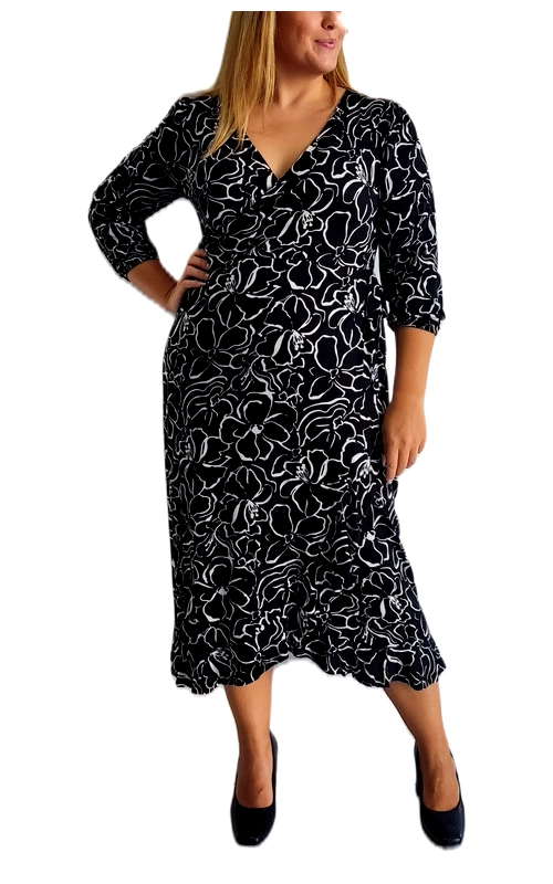 Αυτό το κομψό φόρεμα plus size σε μαύρο χρώμα με λευκό φλοράλ σχέδιο αποτελεί την ιδανική επιλογή για κάθε περίσταση της χειμερινής σεζόν. Το εντυπωσιακό μοτίβο με τα περιγράμματα λουλουδιών δημιουργεί μια εκλεπτυσμένη αντίθεση που κολακεύει τη σιλουέτα. Με το θηλυκό V λαιμόκοψη και τα μανίκια 3/4, προσφέρει άνεση και στυλ για όλη την ημέρα. Η κρουαζέ γραμμή στο μπούστο και η ελαφρώς γραμμή Α στη φούστα χαρίζουν μια εξαιρετικά κολακευτική εφαρμογή που αναδεικνύει τη θηλυκότητα. Το μήκος μέχρι τη μέση της γάμπας είναι ιδανικό για επαγγελματικές συναντήσεις αλλά και βραδινές εξόδους. Μπορεί να φορεθεί με μαύρες γόβες για επίσημες περιστάσεις ή με μποτάκια και ένα ζεστό παλτό για καθημερινές εμφανίσεις. Το ελαστικό ύφασμα προσαρμόζεται τέλεια στο σώμα, χαρίζοντας άνεση καθ\u0027 όλη τη διάρκεια της ημέρας, ενώ η κομψή σχεδίασή του το καθιστά διαχρονικό κομμάτι για κάθε γυναικεία γκαρνταρόμπα. Ένα πραγματικά ευέλικτο ένδυμα που συνδυάζει στυλ και πρακτικότητα.