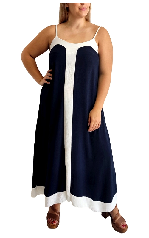 Αυτό το κομψό καλοκαιρινό φόρεμα σε συνδυασμό ναυτικού μπλε και λευκού είναι η τέλεια επιλογή για τις ζεστές μέρες. Με χαλαρή γραμμή και μακρύ μήκος που φτάνει στους αστραγάλους, διαθέτει λεπτά ρυθμιζόμενα τιράντες και ένα εντυπωσιακό κάθετο λευκό πάνελ στο κέντρο που δημιουργεί μια κολακευτική οπτική γραμμή. Το αέρινο ύφασμα προσφέρει άνεση και δροσιά, ενώ η φαρδιά γραμμή του χαρίζει ελευθερία κινήσεων και ταιριάζει σε διάφορους σωματότυπους. Ιδανικό για παραθαλάσσιες βόλτες, καλοκαιρινές διακοπές ή απογευματινές εξόδους, συνδυάζεται τέλεια με πλατφόρμες, όπως φαίνεται στην εικόνα, ή με επίπεδα σανδάλια για πιο casual εμφανίσεις. Ολοκληρώστε το σύνολο με ψάθινη τσάντα και μεγάλα σκουλαρίκια για μια αέρινη καλοκαιρινή εμφάνιση. Το φόρεμα είναι σχεδιασμένο για άνετη εφαρμογή που κολακεύει τη σιλουέτα, προσφέροντας στιλ και αυτοπεποίθηση σε κάθε περίσταση.