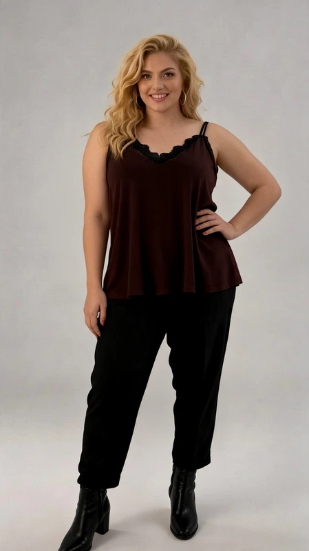Plus size lingerie καφέ - LIN132 | Candiashop Boutique, Αυτό το κομψό σατέν τοπ με τιράντες σε βαθύ καφέ χρώμα αποτελεί την ιδανική προσθήκη στη γκαρνταρόμπα σας για άνεση και στυλ. Η ρέουσα σιλουέτα χαρίζει κολακευτική εφαρμογή σε όλους τους σωματότυπους, ενώ οι λεπτές τιράντες με τη διακριτική δαντελωτή λεπτομέρεια στο ντεκολτέ προσθέτουν μια νότα θηλυκότητας. Ο συνδυασμός του με το μαύρο παντελόνι δημιουργεί ένα κομψό σύνολο ιδανικό για βραδινές εξόδους, αλλά μπορεί εξίσου να φορεθεί με τζιν για πιο καθημερινές περιστάσεις. Το απαλό ύφασμα εξασφαλίζει άνεση καθ' όλη τη διάρκεια της ημέρας, ενώ η χαλαρή γραμμή επιτρέπει ελευθερία κινήσεων. Ιδιαίτερα κατάλληλο για τους θερινούς μήνες, αλλά μπορεί να φορεθεί και το χειμώνα κάτω από ένα σακάκι ή ζακέτα. Διαθέσιμο σε διάφορα μεγέθη, αυτό το πολυμορφικό κομμάτι συνδυάζει την κομψότητα με την πρακτικότητα και αποτελεί απαραίτητο στοιχείο για κάθε γυναικεία γκαρνταρόμπα.