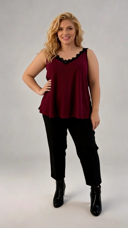 Plus size lingerie μπορντό - LIN131 | Candiashop Boutique, Αυτό το κομψό τοπ σε βαθύ μπορντό χρώμα είναι σχεδιασμένο για να προσφέρει άνεση και στυλ σε κάθε σιλουέτα. Η φαρδιά γραμμή του χαρίζει ελευθερία κινήσεων, ενώ το λεπτό μαύρο δαντελωτό τελείωμα στο ντεκολτέ προσθέτει μια κομψή, θηλυκή πινελιά. Οι λεπτές τιράντες ρυθμίζονται εύκολα για την τέλεια εφαρμογή, ενώ το απαλό, ρέον ύφασμα αγκαλιάζει το σώμα με χάρη. Αυτό το τοπ συνδυάζεται υπέροχα με μαύρα παντελόνια, όπως φαίνεται στην εικόνα, για ένα κομψό βραδινό σύνολο, αλλά μπορεί επίσης να φορεθεί με τζιν για πιο καθημερινές εμφανίσεις. Είναι ιδανικό για καλοκαιρινές βραδιές, επίσημα δείπνα ή ακόμα και για το γραφείο κάτω από ένα σακάκι. Το βαθύ μπορντό χρώμα του κολακεύει όλους τους τόνους επιδερμίδας και προσθέτει ζεστασιά στο πρόσωπο. Η άνετη εφαρμογή του το καθιστά ιδανική επιλογή για όσες αναζητούν στυλ χωρίς συμβιβασμούς στην άνεση.