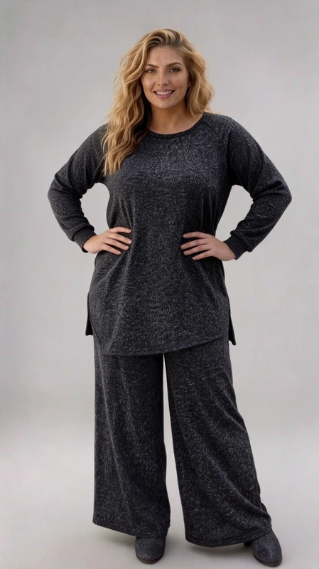 Σετ γυναικείο plus size, ελαστικό, μαύρο με γυναικεία μπλούζα ασύμμετρη συνοδεύεται με πατελόνα.