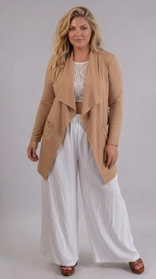 Ζακέτα κρεμ χειμωνιάτικη - ZPS203 | Candiashop Boutique, Η ζακέτα αυτή σε θερμό χρώμα καμηλό αποτελεί το απόλυτο κομμάτι για κάθε γυναικεία γκαρνταρόμπα. Με το χαρακτηριστικό της ανοιχτό μπροστινό άνοιγμα και τις κομψές καταρρακτωτές πτυχώσεις στο ντεκολτέ, δημιουργεί μια ρέουσα, θηλυκή σιλουέτα που κολακεύει κάθε σώμα. Οι μακριές μανίκες και το ελαφρώς επιμηκυμένο πίσω μέρος προσθέτουν έξτρα κομψότητα, ενώ το απαλό, ελαστικό ύφασμα εξασφαλίζει άνεση καθ' όλη τη διάρκεια της ημέρας. Το μονόχρωμο, λιτό σχέδιό της την καθιστά ευέλικτο κομμάτι που συνδυάζεται εύκολα με πλατύ λευκό παντελόνι για ένα boho-chic look, αλλά και με τζιν ή φόρεμα για πιο casual εμφανίσεις. Ιδανική για εξόδους, επαγγελματικά ραντεβού ή ακόμα και για βραδινές εκδηλώσεις, αυτή η ζακέτα συνδυάζει στυλ και λειτουργικότητα με αξεπέραστο τρόπο. Ένα must-have κομμάτι για κάθε εποχή!