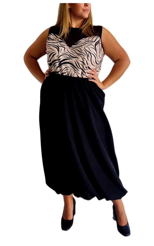 Αυτή η κομψή φούστα σε βαθύ μπλε σκούρο (ναυτικό μπλε) αποτελεί την ιδανική επιλογή για όσες αναζητούν άνεση και στυλ. Με την αέρινη, φαρδιά γραμμή της που φτάνει μέχρι τον αστράγαλο, χαρίζει μια θηλυκή σιλουέτα ενώ προσφέρει απόλυτη ελευθερία κινήσεων. Η ψηλή μέση αναδεικνύει τη σιλουέτα, ενώ το μαλακό, ρέον ύφασμα εξασφαλίζει άνετη εφαρμογή για όλη μέρα. Συνδυάζεται τέλεια με μπλουζάκι αμάνικο στο επάνω μέρος, που διαθέτει εντυπωσιακό μοτίβο σε μπεζ και μαύρο με κυματιστές γραμμές, δημιουργώντας ένα μοντέρνο σύνολο κατάλληλο για πολλές περιστάσεις. Φορέστε την στο γραφείο με μια κομψή ζακέτα, σε βραδινές εξόδους ή ακόμα και σε επίσημες εκδηλώσεις με τα κατάλληλα αξεσουάρ. Η ελαστική μέση εξασφαλίζει άψογη εφαρμογή σε διαφορετικούς σωματότυπους. Ένα ευέλικτο κομμάτι που θα αναβαθμίσει άμεσα την καθημερινή σας γκαρνταρόμπα.