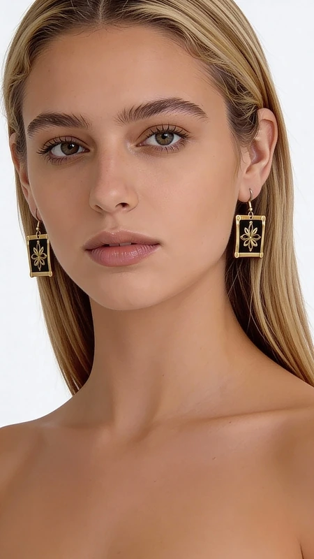 Κεντητά σκουλαρίκια statement με γεωμετρικά σχέδια από χρυσοκλωστή σε μαύρο - SKOUL-4691, Τα κεντητά statement σκουλαρίκια με χρυσοκλωστή σε μαύρο φόντο αποτελούν μια εντυπωσιακή επιλογή που συνδυάζει την παραδοσιακή ελληνική τέχνη του κεντήματος με μοντέρνο design. Σχεδιασμένα από την Ελληνίδα Σχεδιάστρια Κοσμημάτων Αικατερίνη Χαλκιαδάκη, αυτά τα χειροποίητα σκουλαρίκια διακρίνονται για την εξαιρετική ποιότητα και τη μοναδική αισθητική τους.
Τα γεωμετρικά σχέδια με χρυσή κλωστή δημιουργούν έναν εντυπωσιακό οπτικό αντίλογο πάνω στο μαύρο υπόστρωμα, προσφέροντας κομψότητα και στιλ. Η τετράγωνη φόρμα και το κρεμαστό design τα καθιστούν ιδανικά για ειδικές περιστάσεις όπως γάμος - βάπτιση, ή για να προσθέσετε έναν εντυπωσιακό τόνο στην καθημερινή σας εμφάνιση.
Αυτά τα μοντέρνα κεντητά σκουλαρίκια είναι κατάλληλα για γυναίκες που αγαπούν τα statement κοσμήματα και επιζητούν κάτι ιδιαίτερο και πρωτότυπο. Η τέχνη του χειροποίητου κεντήματος δίνει σε κάθε κομμάτι μοναδικότητα και αυθεντικότητα. Φροντίστε να τα φυλάσσετε σε στεγνό μέρος και να τα καθαρίζετε απαλά με μαλακό πανί για να διατηρήσετε την ομορφιά τους.
Υλικό: Ορείχαλκος, Ύφασμα